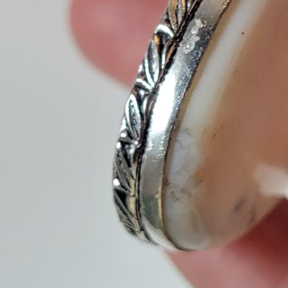 Handmade Silver Pendant With White Dendritic Opal & Floral Bail Detailing - Picture 5 of 10